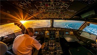 لحظۀ زیبای طلوع خورشید در کابین هواپیما + عکس